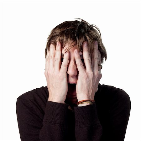 Scared man hiding behnid his hands Stock Photo - Budget Royalty-Free & Subscription, Code: 400-05213238