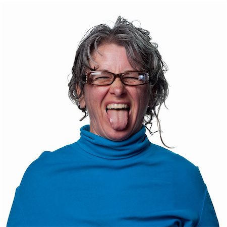 Woman sticks her tongue out at the camera Stock Photo - Budget Royalty-Free & Subscription, Code: 400-05213284
