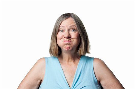 funny faces of old people - Woman making a funny face to entertain grandchildren Stock Photo - Budget Royalty-Free & Subscription, Code: 400-05213314