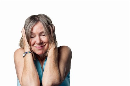 Woman covers her ears after a loud noise Stock Photo - Budget Royalty-Free & Subscription, Code: 400-05213317