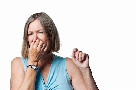 smelling old people - Woman covers her nose due to a bad smell Stock Photo - Budget Royalty-Free & Subscription, Code: 400-05213318