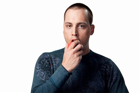 Young man eating an organic healthy snack Stock Photo - Budget Royalty-Free & Subscription, Code: 400-05213693