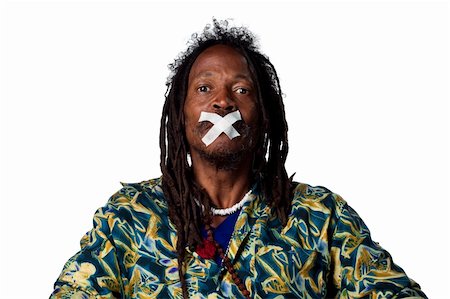 rastafarian - Black man with no voice, tape covering his mouth Photographie de stock - Aubaine LD & Abonnement, Code: 400-05213757
