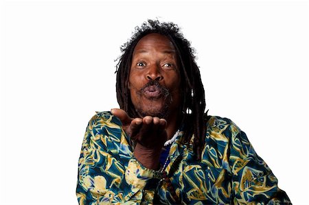 rastafarian - Man blowing a kiss to the camera, isolated image Photographie de stock - Aubaine LD & Abonnement, Code: 400-05213750