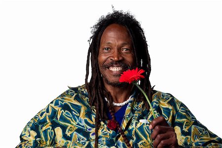 rastafarian - Man holding a red daisy flower, isolated image Photographie de stock - Aubaine LD & Abonnement, Code: 400-05213763