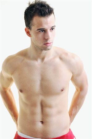 simsearch:400-06859184,k - handsome young man with muscles and fit body isolated on white Stockbilder - Microstock & Abonnement, Bildnummer: 400-05224482