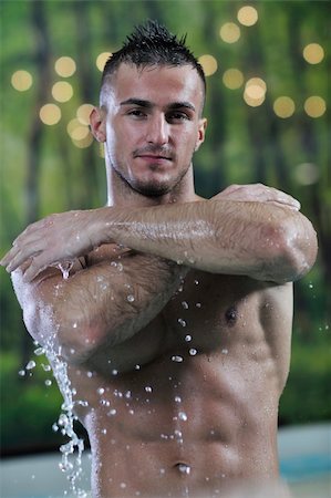 young healthy good looking macho man model athlete at hotel indoor pool Stock Photo - Budget Royalty-Free & Subscription, Code: 400-05224523