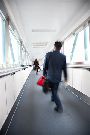 Motion Blured business people  in the corridor of an airport. Stock Photo - Budget Royalty-Free & Subscription, Code: 400-05225190