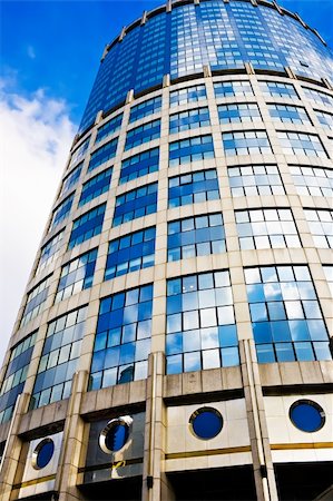 High modern business skyscraper with clouds reflections Stock Photo - Budget Royalty-Free & Subscription, Code: 400-05225580