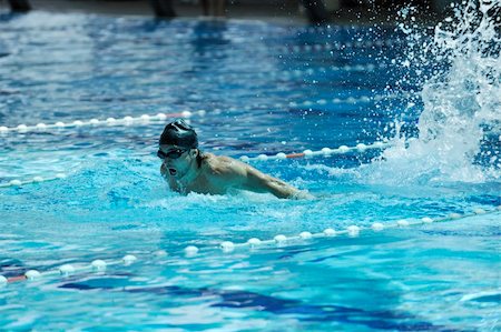 young healthy with muscular body man swim on swimming pool and representing healthy and recreation concept Fotografie stock - Microstock e Abbonamento, Codice: 400-05225911