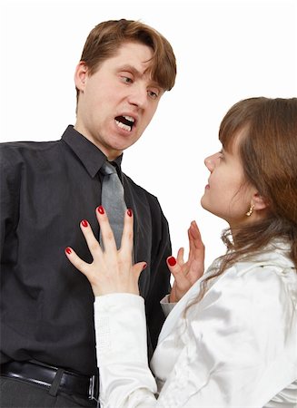 The man terribly shouts at the young woman is isolated on a white background Stock Photo - Budget Royalty-Free & Subscription, Code: 400-05226148