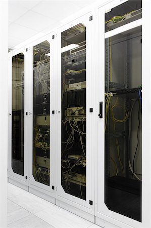 Racks with network equipment in technology telehouse room Stock Photo - Budget Royalty-Free & Subscription, Code: 400-05226340