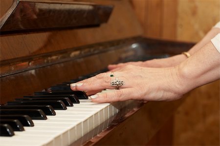 simsearch:400-07338880,k - A caucasian woman's hand playing a keyboard Stock Photo - Budget Royalty-Free & Subscription, Code: 400-05226533