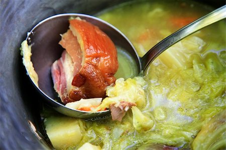 soup and crackers - Pig-iron saucepan with cabbage soup and the big piece of meat Stock Photo - Budget Royalty-Free & Subscription, Code: 400-05226848