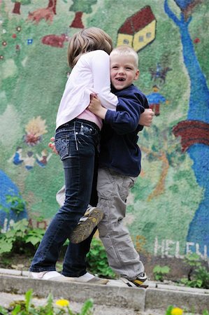 happy family sister and brother have fun and play games outdoor in park Stock Photo - Budget Royalty-Free & Subscription, Code: 400-05227168