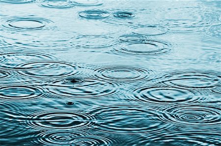 Rain falling on the water and creating concentric circles on the surface Stock Photo - Budget Royalty-Free & Subscription, Code: 400-05227406
