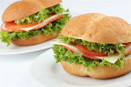 Ham and cheese sandwiches with tomatoes and lettuce Stock Photo - Budget Royalty-Free & Subscription, Code: 400-05227494