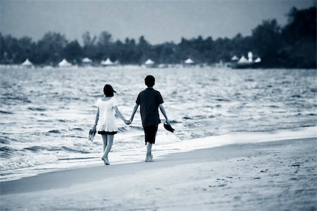 Couple on sunset. Coast of the Indian ocean Stock Photo - Budget Royalty-Free & Subscription, Code: 400-05227851