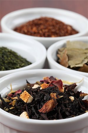 simsearch:400-05678542,k - White bowls with various kinds of tea - focus on black tea with flower petals and dried orange peel Foto de stock - Super Valor sin royalties y Suscripción, Código: 400-05228303