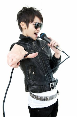 simsearch:400-05094854,k - Asian rock singer in performance, isolated on white, focus on fingers. Photographie de stock - Aubaine LD & Abonnement, Code: 400-05229388