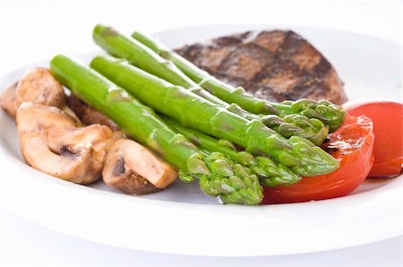 Fresh cooked asparagus accompanies a delicious meal. Stock Photo - Budget Royalty-Free & Subscription, Code: 400-05229668