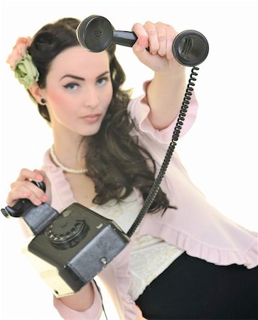 beautiful young woman girl talking on old phone isolated on white in studio Stock Photo - Budget Royalty-Free & Subscription, Code: 400-05229832