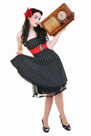 retro pin up girls - pretty girl listening music on radio isolated on white in studio Photographie de stock - Aubaine LD & Abonnement, Code: 400-05229871