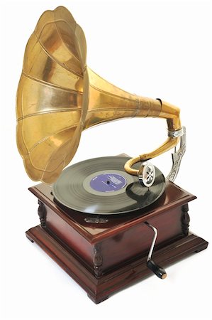 record isolated - retro old gramophone with horn speaker  for playing music over plates  isolated on white in studio Stock Photo - Budget Royalty-Free & Subscription, Code: 400-05229945