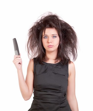Disheveled woman in a black dress holding a comb Stock Photo - Budget Royalty-Free & Subscription, Code: 400-05229955