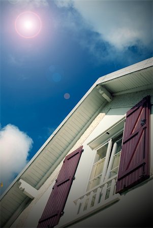 raphtong (artist) - house on blue sky and sun style vintage Fotografie stock - Microstock e Abbonamento, Codice: 400-05220368