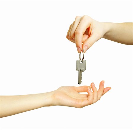 simsearch:400-07061230,k - hand holds a key isolated on white Photographie de stock - Aubaine LD & Abonnement, Code: 400-05220475