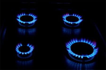 flames of gas stove in the dark Stock Photo - Budget Royalty-Free & Subscription, Code: 400-05220472