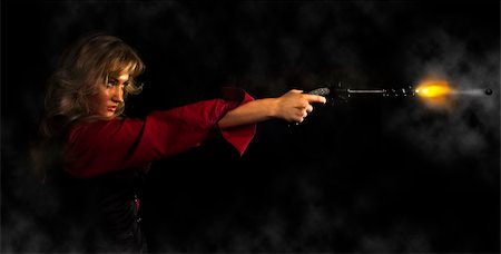 portrait of a young girl in a red shirt with a gun Stock Photo - Budget Royalty-Free & Subscription, Code: 400-05220905
