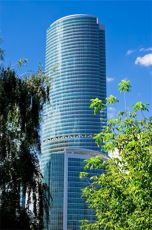 simsearch:400-05714281,k - High skyscraper and green tree in Moscow city Photographie de stock - Aubaine LD & Abonnement, Code: 400-05221375