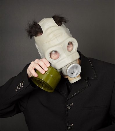 rubber jacket black - Portrait of a funny guy in a mask on a dark background Stock Photo - Budget Royalty-Free & Subscription, Code: 400-05221566