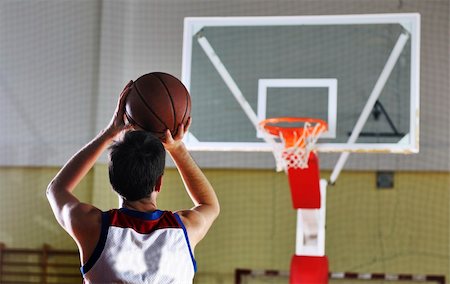 basketball game playeer shooting on basket indoor in gym Stock Photo - Budget Royalty-Free & Subscription, Code: 400-05221905