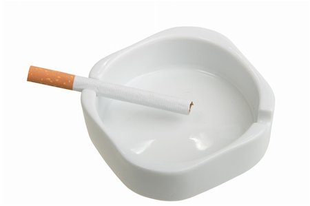 simsearch:400-04274877,k - White ashtray with cigarette. Studio photography. Close-up. Isolated on white background. Photographie de stock - Aubaine LD & Abonnement, Code: 400-05221974