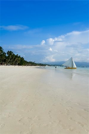 traditional paraw sailing boats on white beach on boracay island in the philippines Stock Photo - Budget Royalty-Free & Subscription, Code: 400-05222507