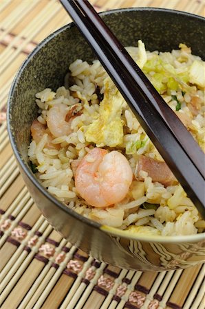 fried rice bowl - Close up of bowl of fried rice with chopstick Stock Photo - Budget Royalty-Free & Subscription, Code: 400-05223086