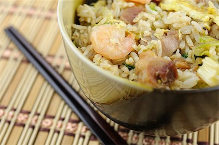 fried rice bowl - Close up of bowl of fried rice with chopstick Stock Photo - Budget Royalty-Free & Subscription, Code: 400-05223098