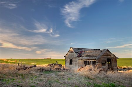 old abandoned house and farming machinery on Colorado prairie with green fields in background Stock Photo - Budget Royalty-Free & Subscription, Code: 400-05223158