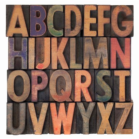 English alphabet (upper case) in vintage wooden letterpress type, stained by different color ink, flipped horizontally, isolated on white Stock Photo - Budget Royalty-Free & Subscription, Code: 400-05223159