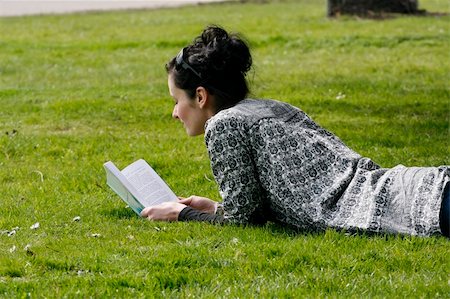 dreaming cloud girl - Woman lying in grass outdoor in park reading book Stock Photo - Budget Royalty-Free & Subscription, Code: 400-05223238