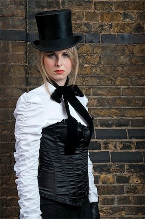 Portrait of beautiful woman in late victorian costume against brick wall Stock Photo - Budget Royalty-Free & Subscription, Code: 400-05223241