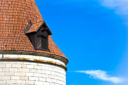 beautiful old roof top of Kuressaare castle tower with blue sky in background(Saarema, Estonia) Stock Photo - Budget Royalty-Free & Subscription, Code: 400-05234348