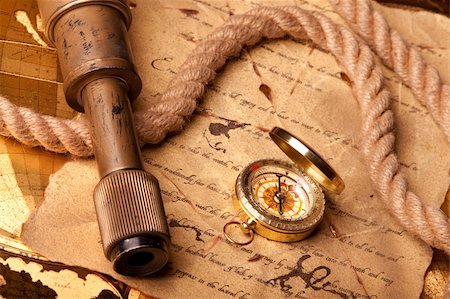find us - Old navigation equipment, old gold colours and treasure map Stock Photo - Budget Royalty-Free & Subscription, Code: 400-05234586