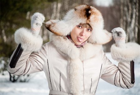 simsearch:400-06132090,k - winter portrait of young and beautiful natural looking woman in casual clothes showing her tongue Photographie de stock - Aubaine LD & Abonnement, Code: 400-05234819