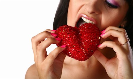 simsearch:400-04932642,k - pretty girl is eating heart isolated on whit  background Foto de stock - Super Valor sin royalties y Suscripción, Código: 400-05234883