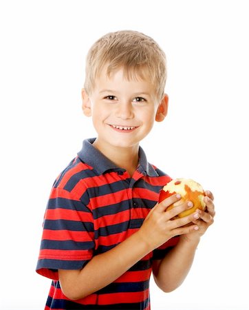 simsearch:400-05014700,k - Boy holding an apple  isolated on white background Fotografie stock - Microstock e Abbonamento, Codice: 400-05235104