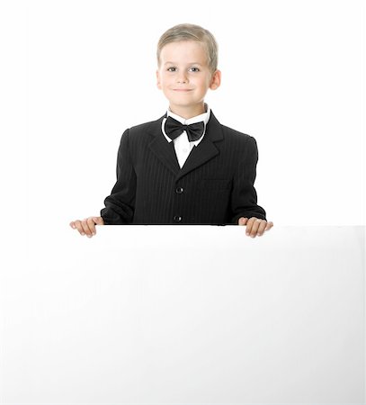 simsearch:400-04340435,k - Boy holding a banner isolated on white background Stock Photo - Budget Royalty-Free & Subscription, Code: 400-05235116